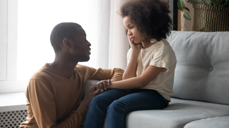 Dad talking to daughter