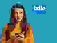 A person holding up a cellphone with the Tello logo above their head.