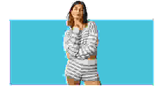 A model wearing a matching striped pajama set.