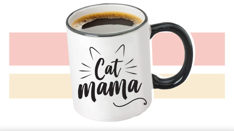 Cup of coffee with "cat mama" on front.
