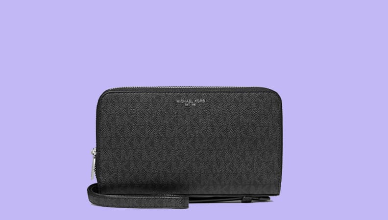 Black wallet against purple background