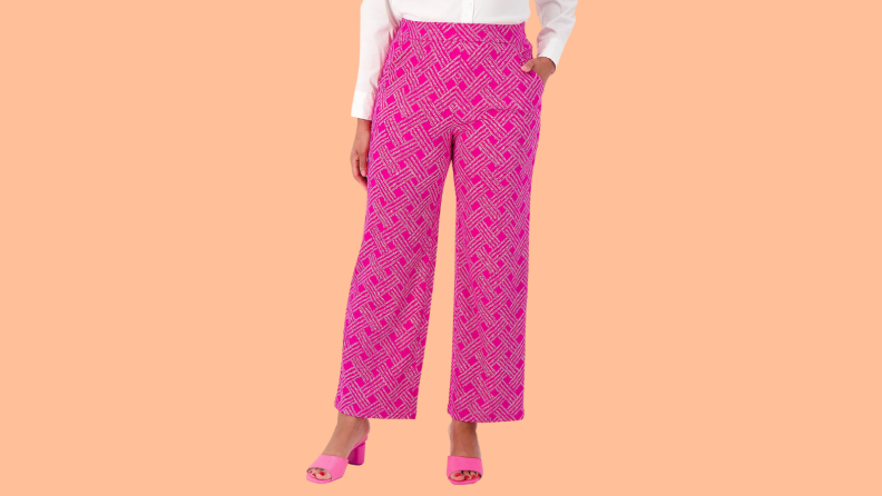 An image of a pair of hot pink wide-leg pants with a cross pattern.