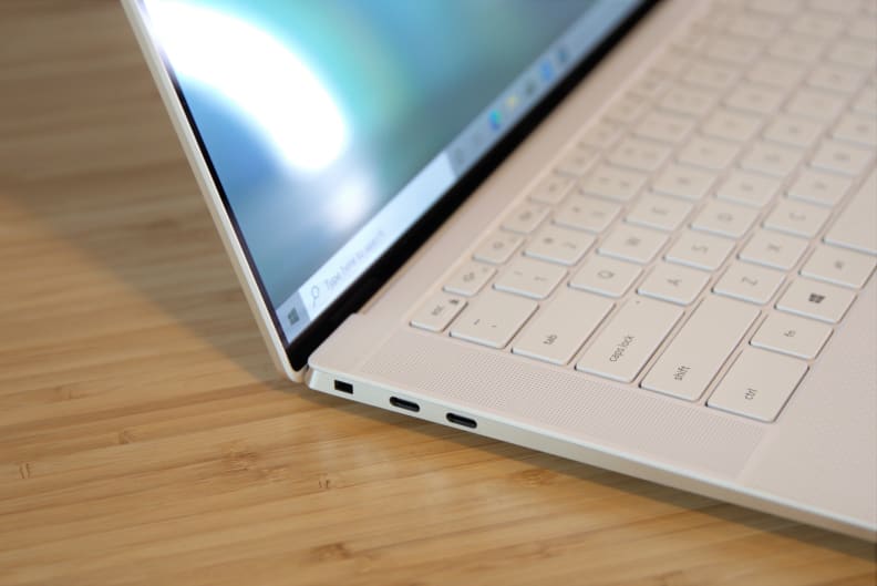 A Dell XPS 15 with OLED display on a desk.
