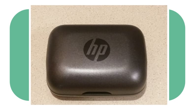 HP Hearing Pro OTC hearing aid charging case on countertop surface.