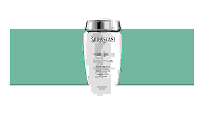 Kerastase hair product on a green background.