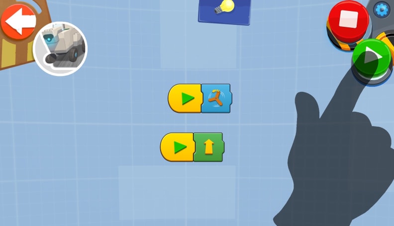 Coding in the LEGO BOOST app involves dragging and dropping icons