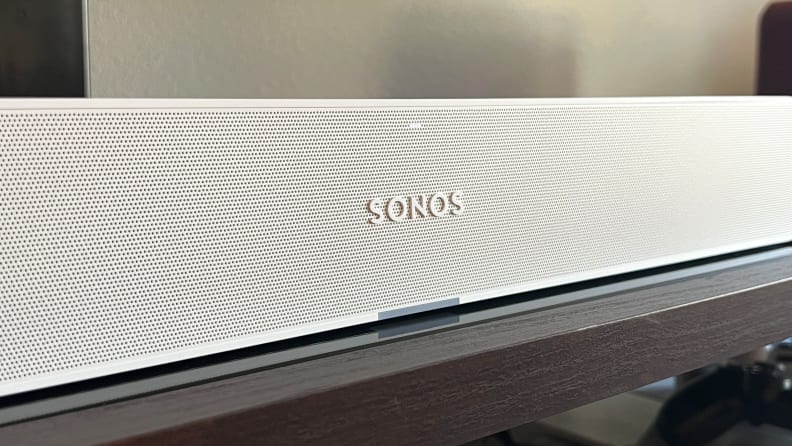 The Ray's white front grille is shown close up on a brown and black TV console.