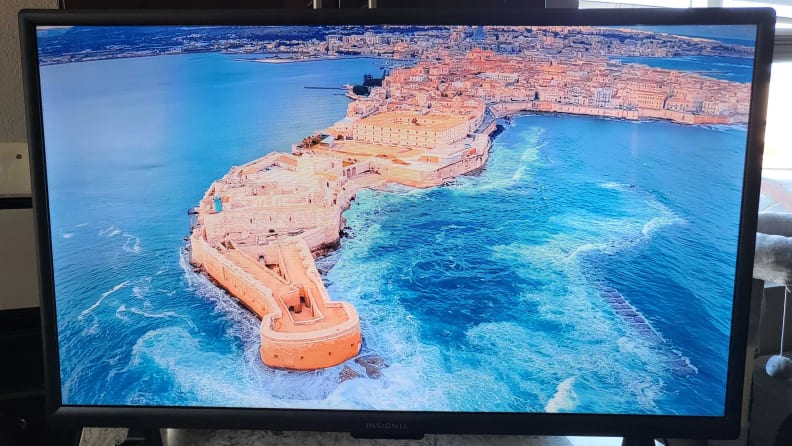 The Insignia F20 Fire TV displaying an island in the ocean
