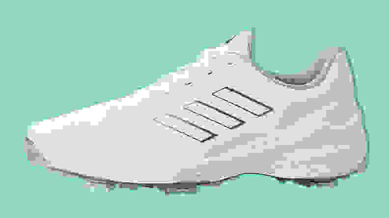 Adidas Men's ZG23 Golf Shoe on a teal background.