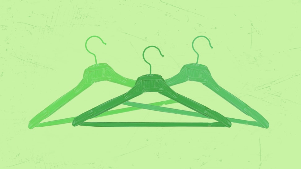 three green hangers on green background