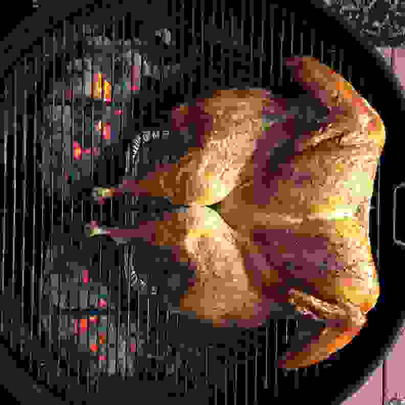 A spatchcock turkey on a grill