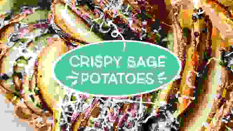 Cheesy, thinly sliced potato rounds in a glass baking dish with text overlaid that reads as follows: crispy sage potatoes.