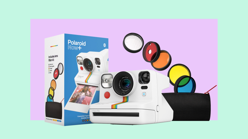 Polaroid film camera next to different colored film lenses.