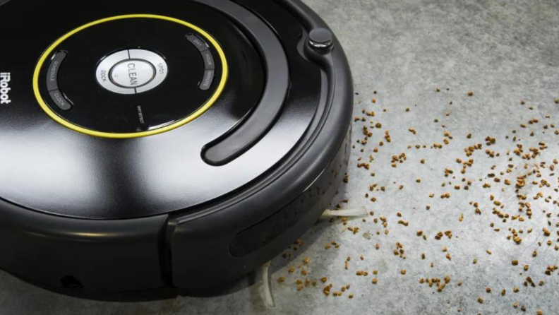 An iRobot vacuum picking up coarse debris.