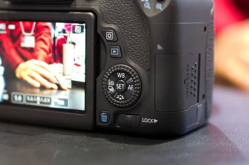 This rear control wheel splits the difference between the Rebel cameras and the higher-end EOS D series.