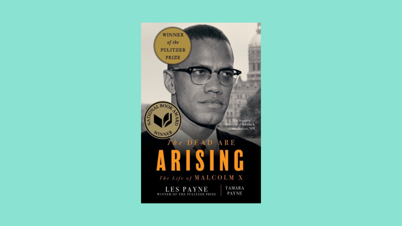 The book cover to "The Dead Are Rising," a biography of Malcolm X, by Les Payne, features an image of the famous civil rights leader.