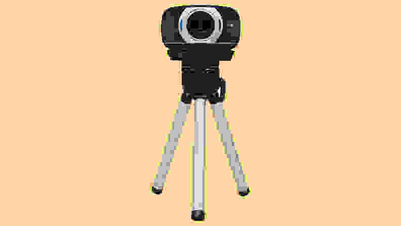 Webcam on tripod with yellow background
