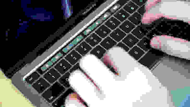 A person types on the keyboard.