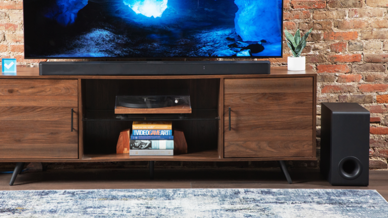 The LG S95TR below a flatscreen.