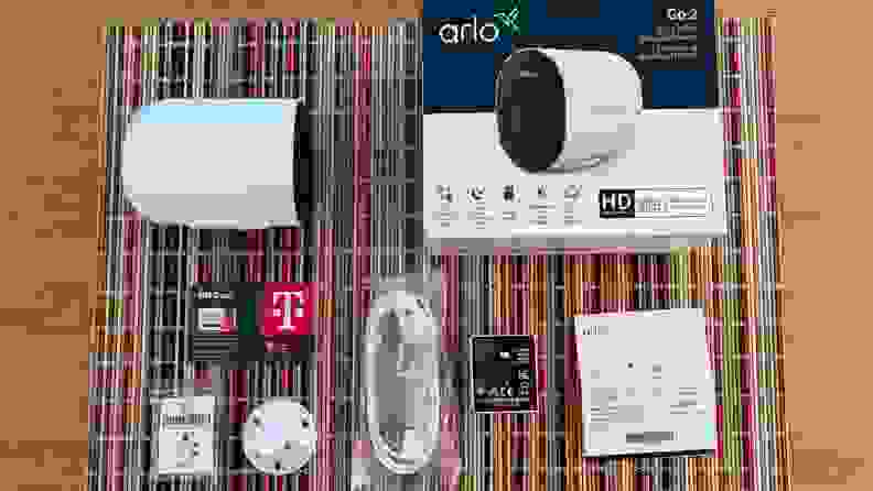 The retail box of the Arlo Go 2 with all of its contents outside the box.