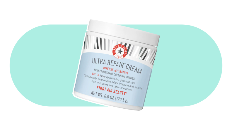 A jar of First Aid Beuty Ultra Repair Cream on a colorful background