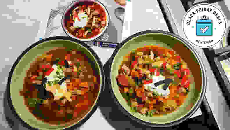 Two bowls of Home Chef buffalo turkey chili with the Black Friday Deals Reviewed badge.