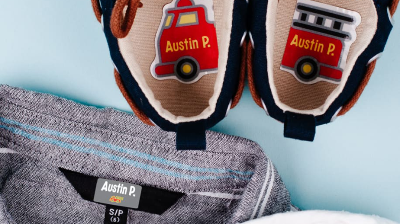 A pair of shoes with fire truck name labels inside