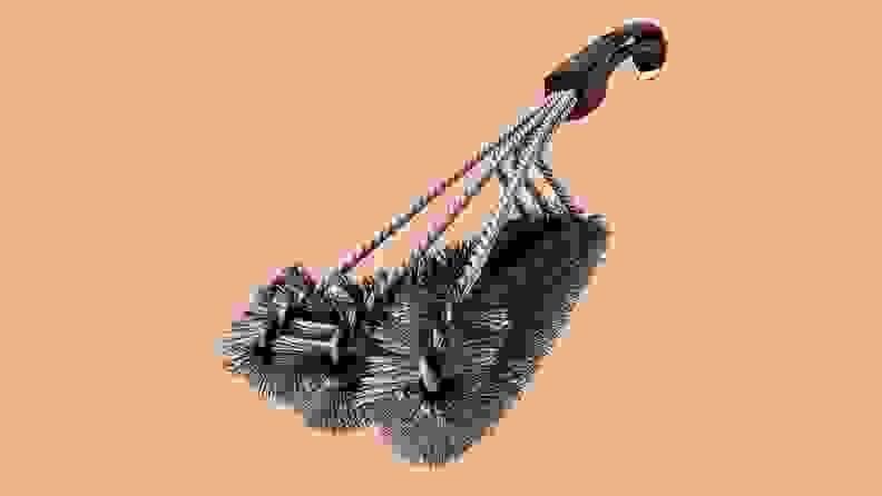 Grill brush on orange background