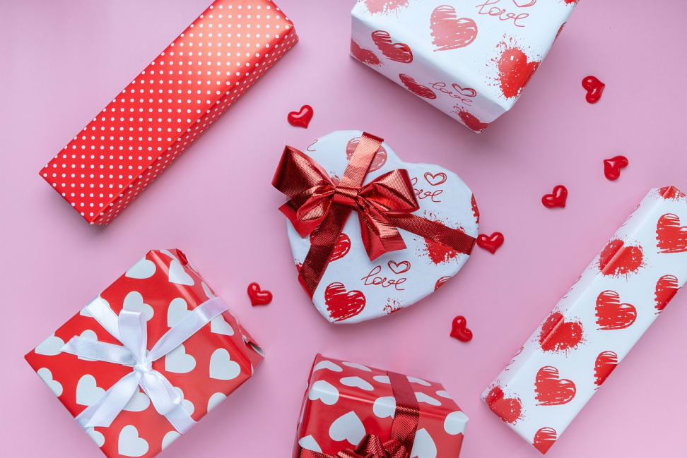 Valentine's Day gifts on a pink background.