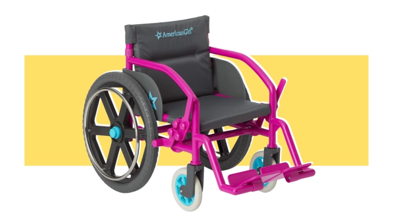An American Girl Ultralight Wheelchair in the colors purple, blue, and black on a yellow background.