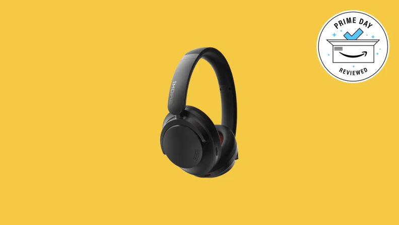 A pair of black wireless headphones on a colored background