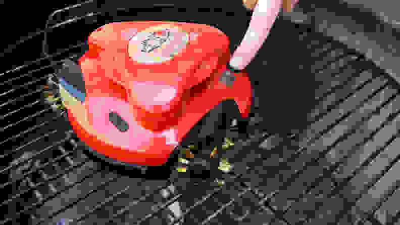 Grillbot button being pressed