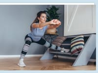 A person doing some home workouts and stretches.