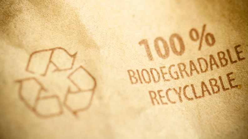 Close up of a brown paper bag with a recycling stamp.