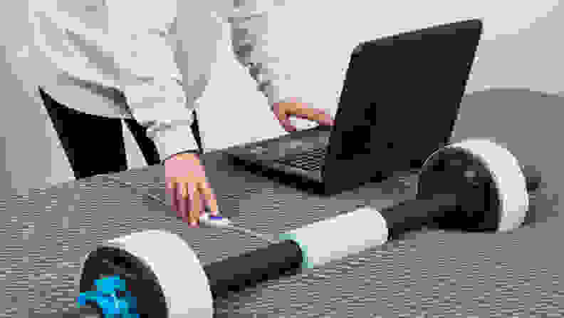 A person measuring the pressure points on the Tuft & Needle Mint hybrid mattress.