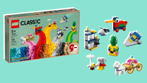 A child smiles as they play with the Lego Classic 90th anniversary set