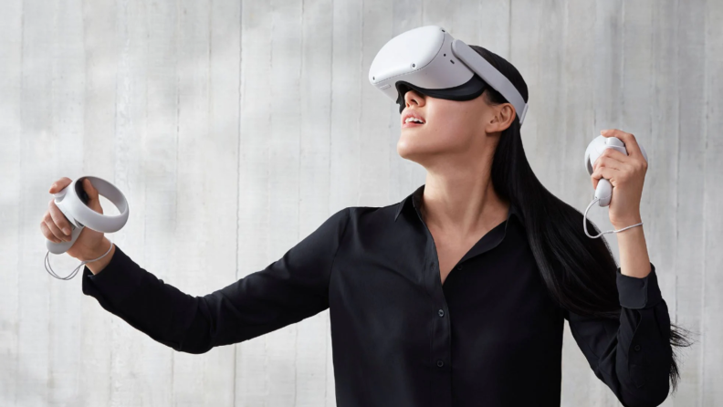 An image of a woman playing the Oculus Quest 2.