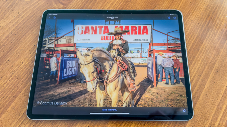 The iPad Air 2024 with a picture of a man on a horse at a rodeo on the screen.