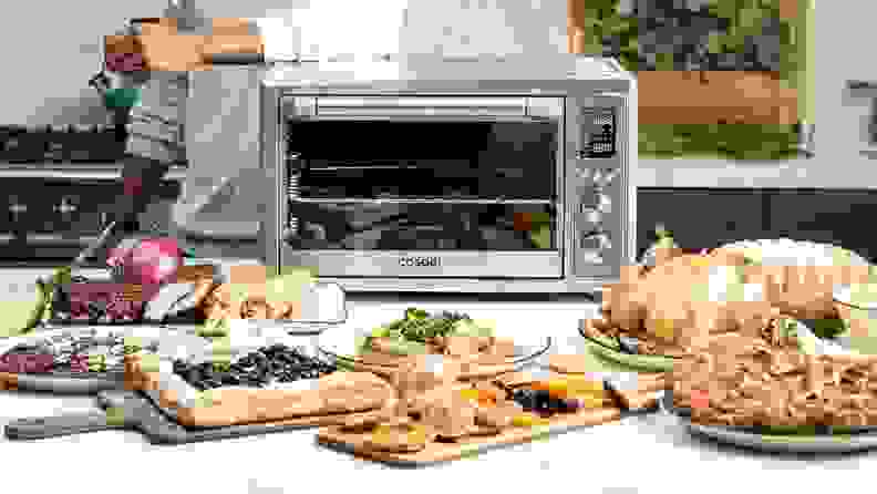a spread of food outside of a toaster oven.