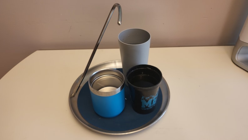 A Topple Tray holding 3 cups of liquid