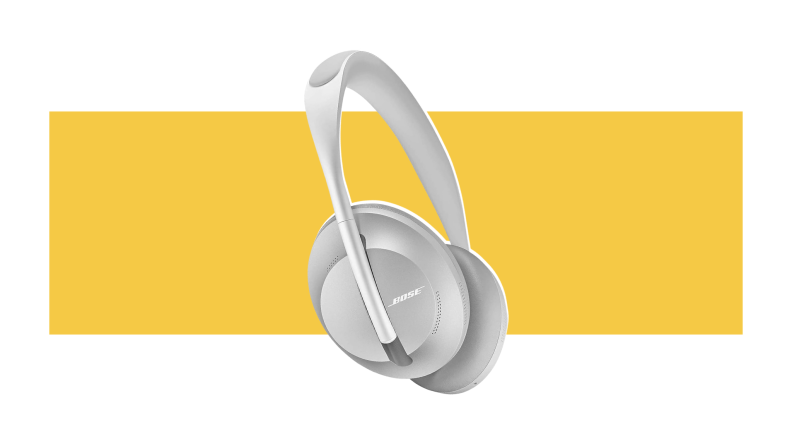 Silver Bose Noise Cancelling Headphones 700 against a yellow background