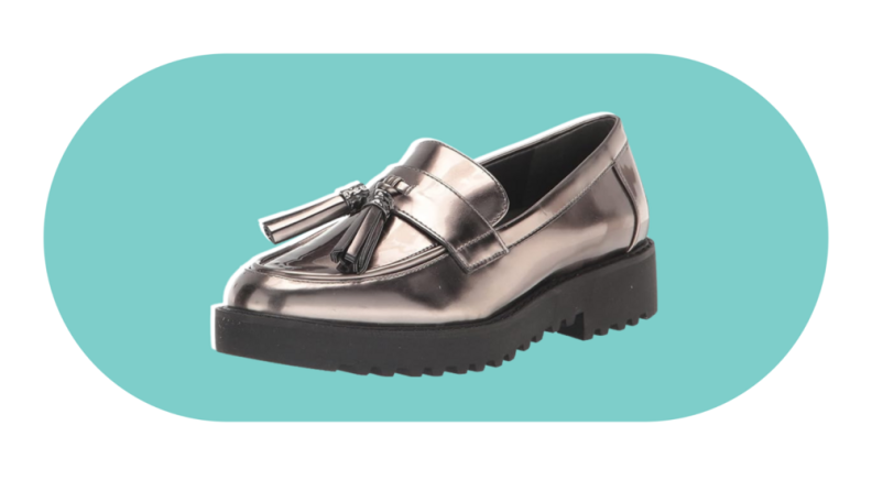 A metallic silver leather loafer with a tassel detail.