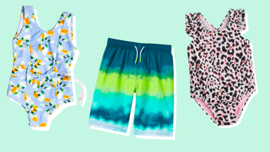 Two one-piece swimsuits and a pair of swim shorts against a green background.