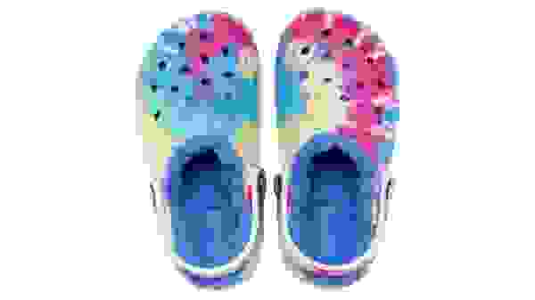 Colorful tie-dye crocs on white background