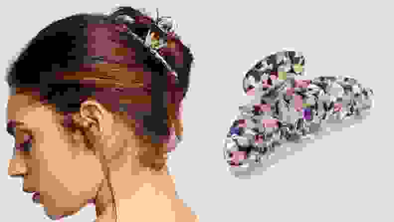 On the left: The profile of a person with long, dark brown hair wearing a claw clip to tie the hair up. On the right: A purple, pink, and green printed claw clip sitting on a white background.