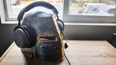 The Beyerdynmic MMX 150 poised on a knight's helmet