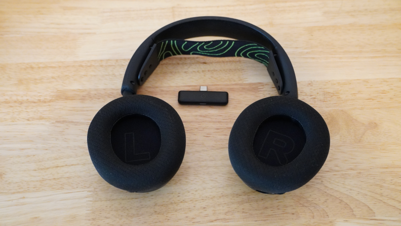 The muffs of the steelseries Arctis Nova 5X Wireless headphones and the receiver.