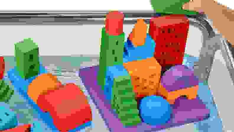 A colorful set of buoyant toy blocks with a city-scape printed on them.