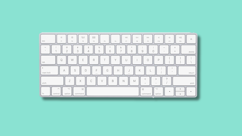 The Apple Magic Keyboard on a green background.