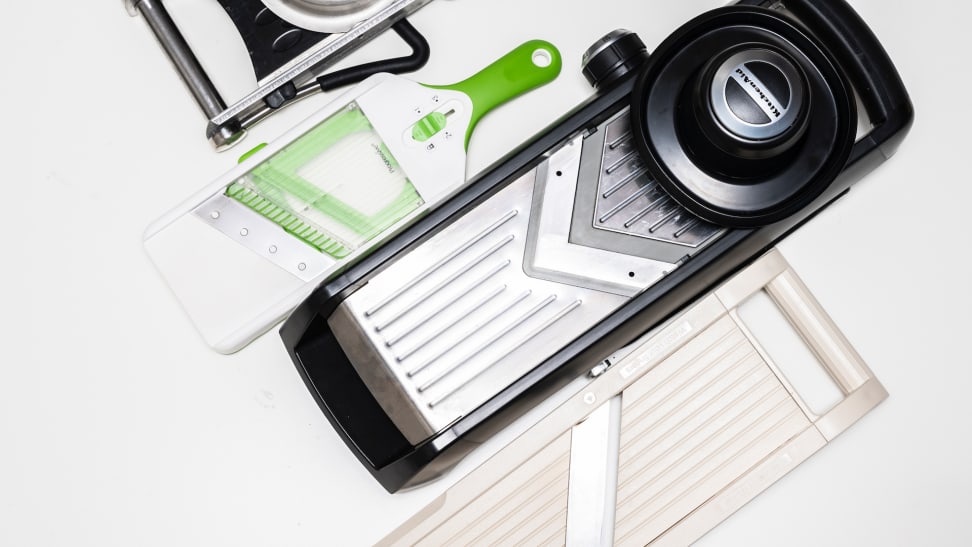 Different mandoline slicers are lined up in a diagonal line